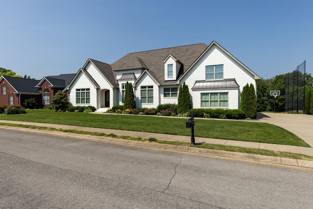 836 Savannah W Ct, Springfield, TN 37172 - view of front of house featuring a standing seam roof, a front yard, and metal roof