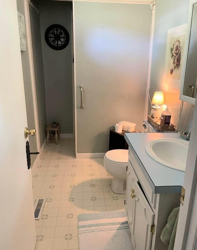 139 Hillcrest Cir, Gordonsville, TN 38563 - bathroom with tile patterned flooring, vanity, toilet, baseboards, and visible vents