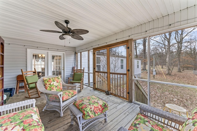sunroom with a ceiling fan