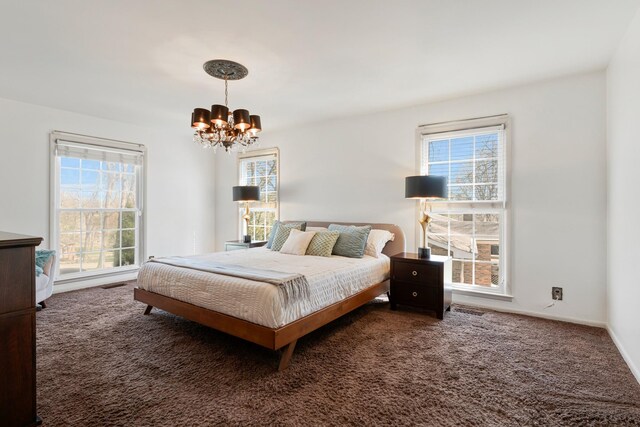 409 Cunniff Pkwy, Goodlettsville, TN 37072 - carpeted bedroom featuring multiple windows, visible vents, baseboards, and a chandelier