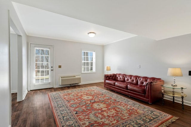 409 Cunniff Pkwy, Goodlettsville, TN 37072 - living area with dark wood-type flooring, ornamental molding, baseboards, and a wall mounted air conditioner