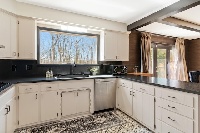 409 Cunniff Pkwy, Goodlettsville, TN 37072 - kitchen featuring a sink, dark countertops, and stainless steel dishwasher