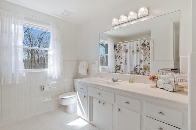 409 Cunniff Pkwy, Goodlettsville, TN 37072 - full bath featuring tile patterned flooring, vanity, tile walls, toilet, and visible vents