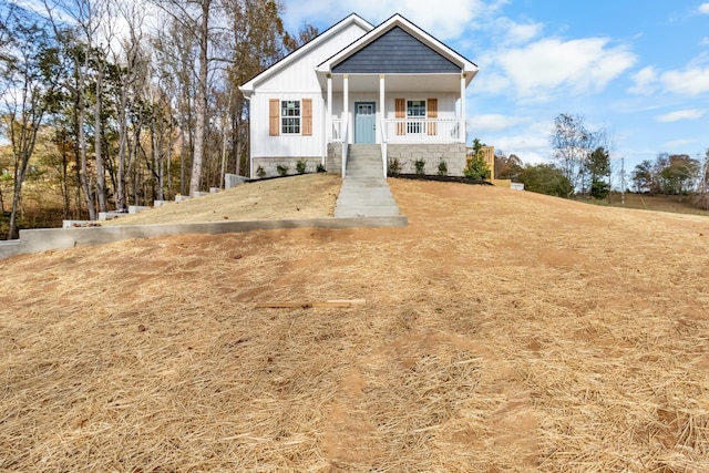 view of front of house with a porch and board and batten siding