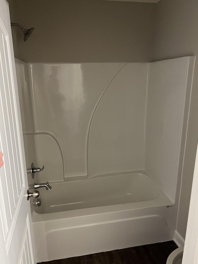 967 Horse Mountain Rd Unit 6G, Shelbyville, TN 37160 - bathroom featuring wood finished floors and washtub / shower combination