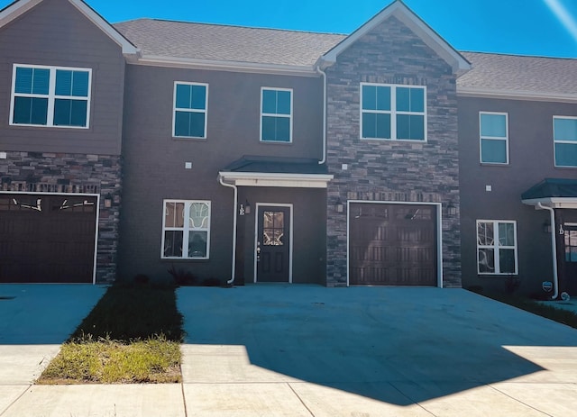 967 Horse Mountain Rd Unit 6D, Shelbyville, TN 37160 - view of front facade with driveway, a shingled roof, stone siding, and a garage