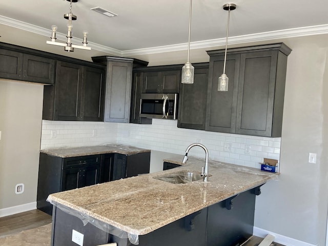 967 Horse Mountain Rd Unit 6D, Shelbyville, TN 37160 - kitchen featuring stainless steel microwave, a sink, light stone counters, and decorative backsplash