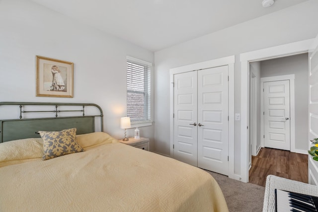 bedroom with baseboards and a closet