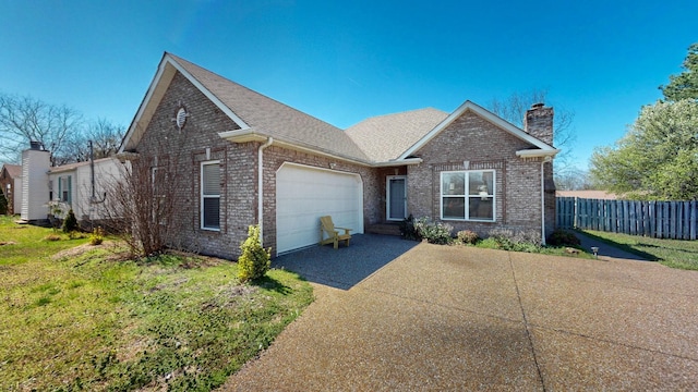510 Castleview Dr, Lebanon, TN 37087 - view of front of house featuring fence, an attached garage, driveway, brick siding, and a chimney