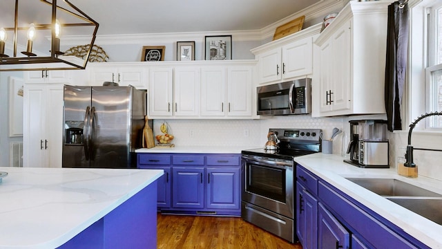 510 Castleview Dr, Lebanon, TN 37087 - kitchen featuring crown molding, a sink, white cabinetry, stainless steel appliances, and blue cabinetry