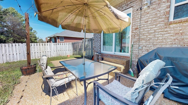510 Castleview Dr, Lebanon, TN 37087 - view of patio with a grill, fence, and outdoor dining space