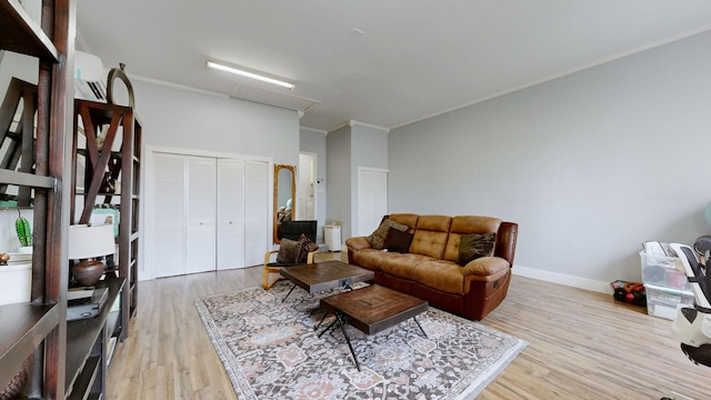 510 Castleview Dr, Lebanon, TN 37087 - living room featuring light wood finished floors, baseboards, a wall mounted air conditioner, and ornamental molding
