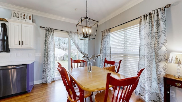 510 Castleview Dr, Lebanon, TN 37087 - dining area with baseboards, a notable chandelier, crown molding, and light wood-style floors