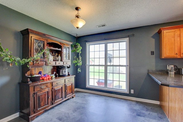 4425 Taylor Hall Ln, Adams, TN 37010 - doorway to outside featuring visible vents, baseboards, and a textured ceiling