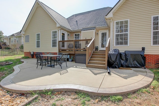 4425 Taylor Hall Ln, Adams, TN 37010 - rear view of house with roof with shingles, a deck, fence, and a patio area