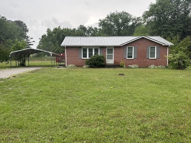 311 Thomas St, Lawrenceburg, TN 38464 - single story home featuring brick siding, a carport, a front lawn, and driveway