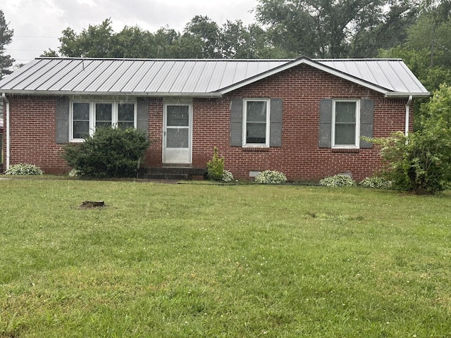 311 Thomas St, Lawrenceburg, TN 38464 - single story home featuring a front lawn, metal roof, and brick siding