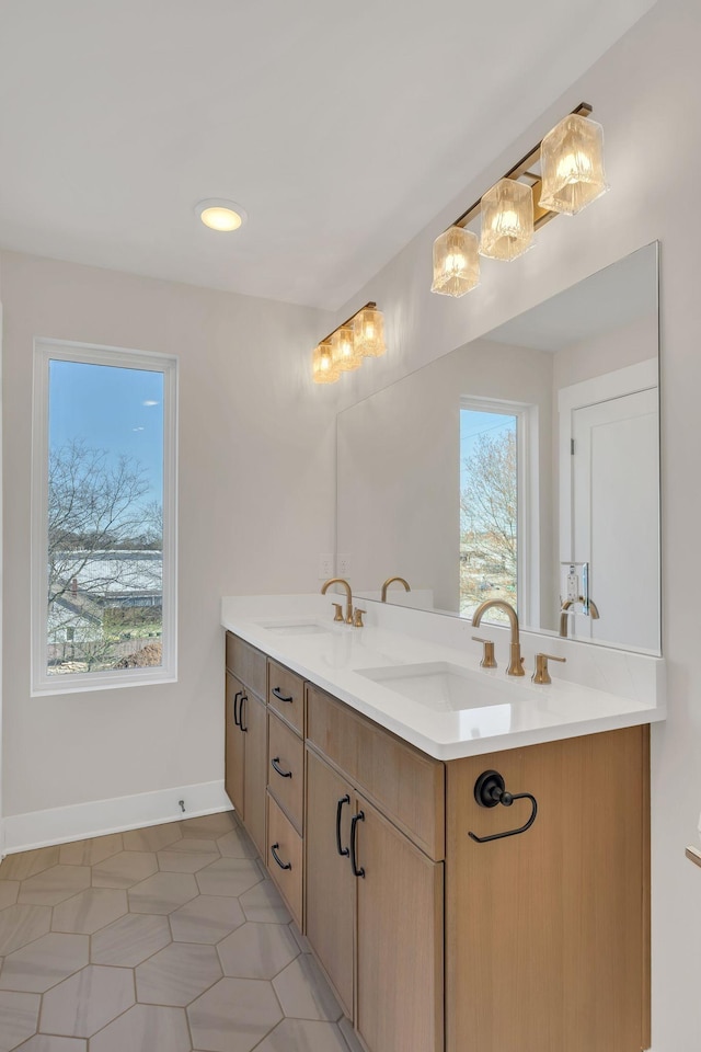 1016 W Kirkland Ave Unit F, Nashville, TN 37216 - bathroom featuring double vanity, baseboards, and a sink