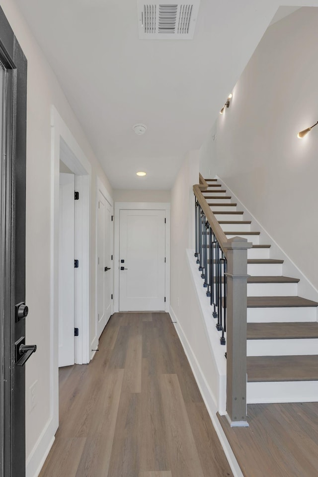 1016 W Kirkland Ave Unit F, Nashville, TN 37216 - corridor with baseboards, visible vents, wood finished floors, and stairway