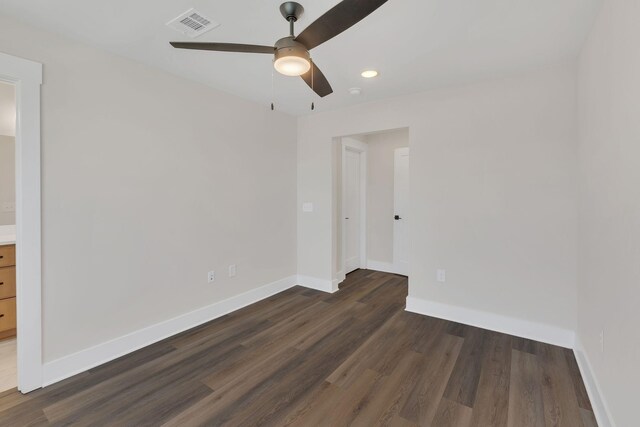 1016 W Kirkland Ave Unit F, Nashville, TN 37216 - unfurnished bedroom with visible vents, baseboards, ceiling fan, connected bathroom, and dark wood finished floors