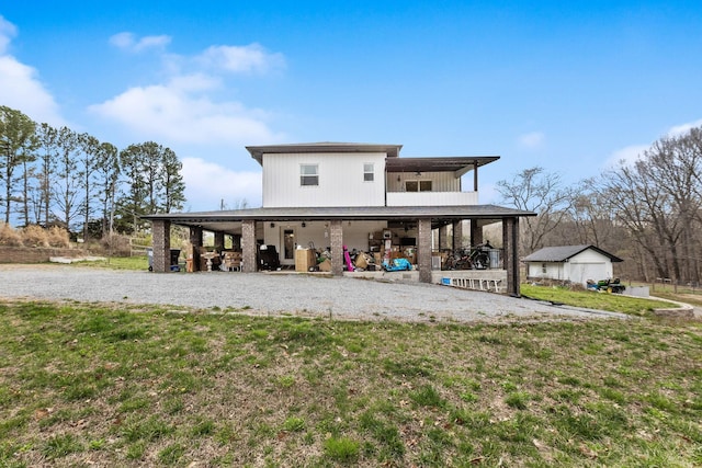 back of property featuring a lawn