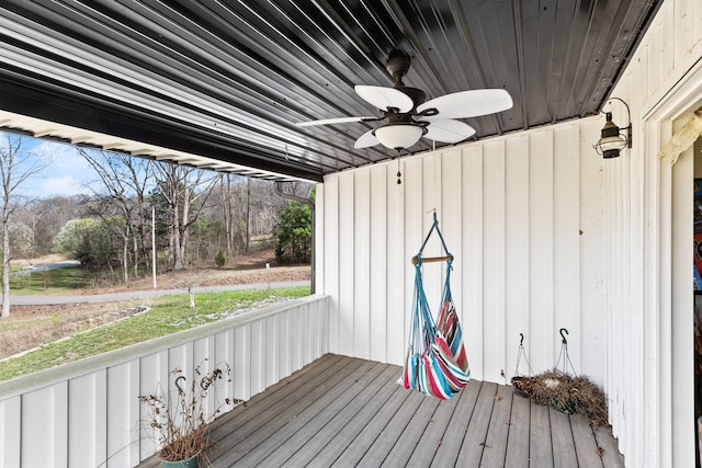wooden terrace with a ceiling fan