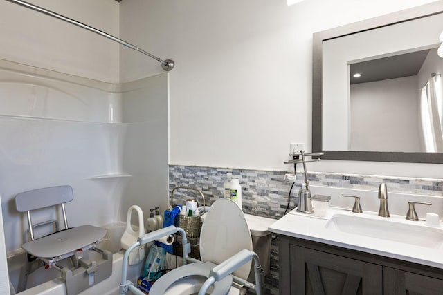full bath featuring vanity and bathtub / shower combination