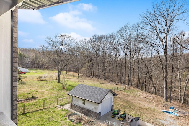 exterior space featuring a wooded view