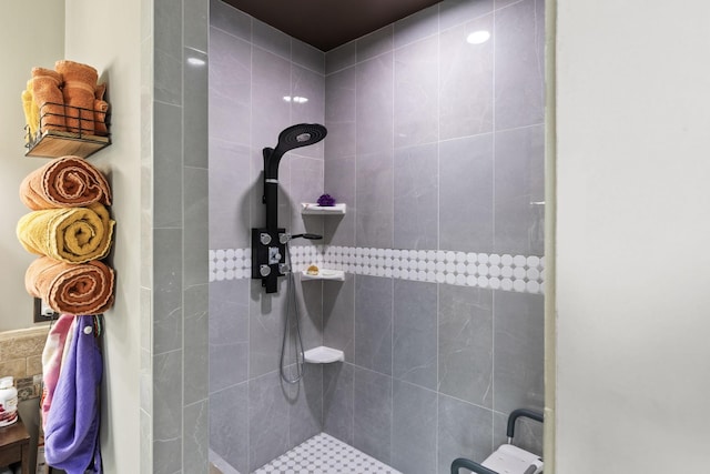 bathroom with a tile shower