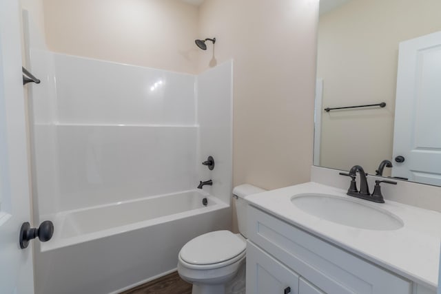 bathroom featuring bathing tub / shower combination, vanity, toilet, and wood finished floors