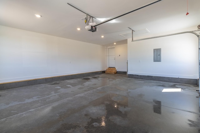 garage featuring electric panel, recessed lighting, and a garage door opener