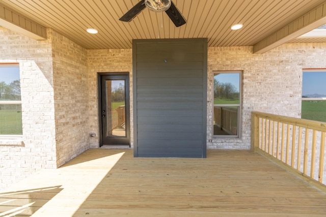 property entrance featuring brick siding