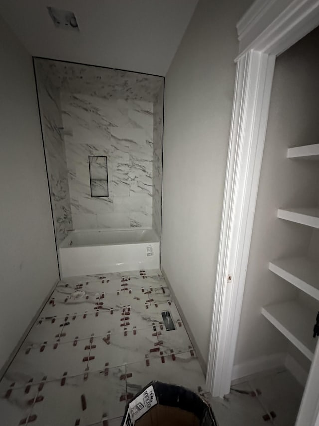 230 Hall Ct, Clarksville, TN 37043 - bathroom featuring a tub to relax in and baseboards