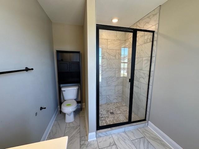 full bathroom with marble finish floor, toilet, a stall shower, and baseboards