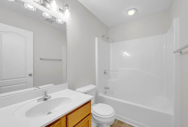 full bath featuring toilet, vanity, tile patterned floors, and shower / washtub combination