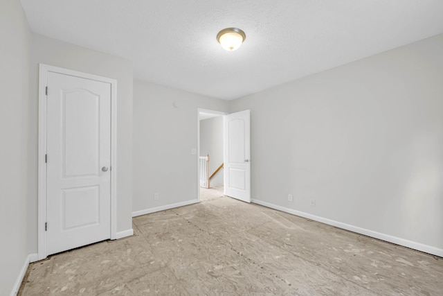 unfurnished bedroom featuring baseboards