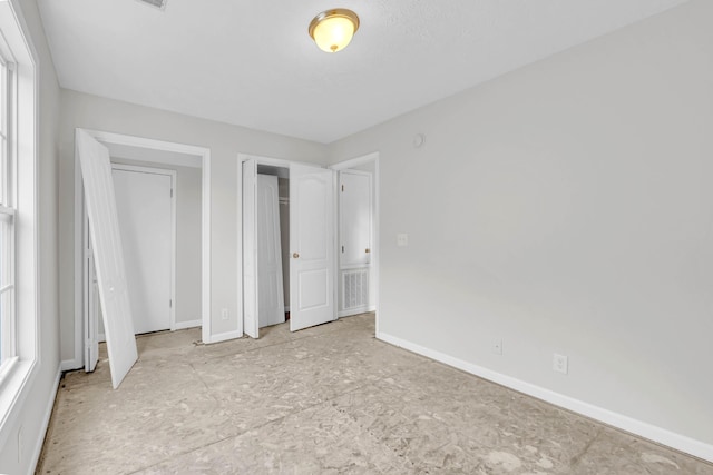 unfurnished bedroom featuring baseboards