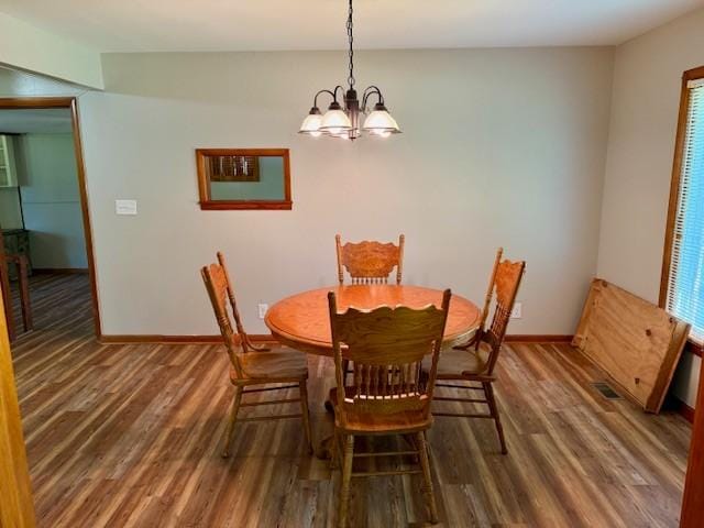 1302 Old Estill Springs Rd, Tullahoma, TN 37388 - dining space with a chandelier, wood finished floors, and baseboards