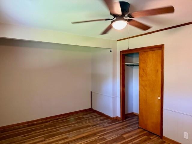 1302 Old Estill Springs Rd, Tullahoma, TN 37388 - unfurnished bedroom featuring dark wood-style flooring, a closet, baseboards, and ceiling fan