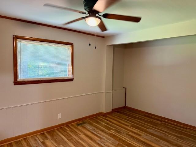 1302 Old Estill Springs Rd, Tullahoma, TN 37388 - spare room featuring a ceiling fan and wood finished floors