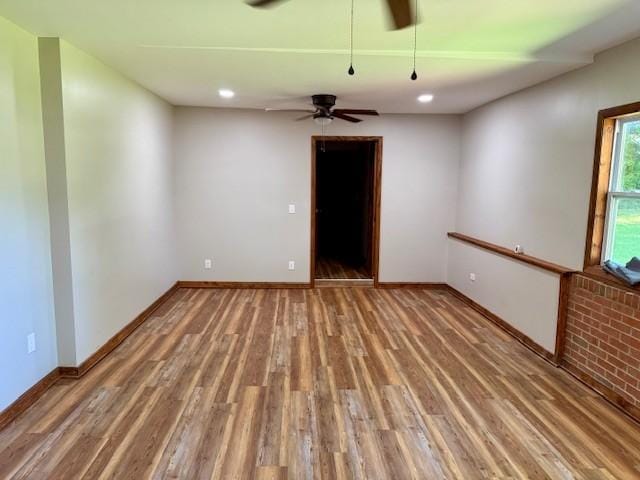 1302 Old Estill Springs Rd, Tullahoma, TN 37388 - empty room with wood finished floors, baseboards, a ceiling fan, and recessed lighting