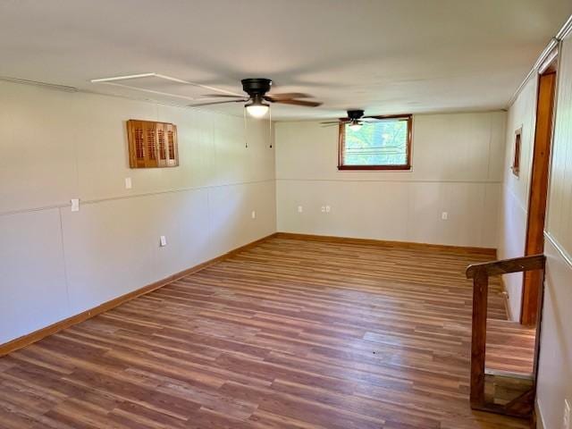 1302 Old Estill Springs Rd, Tullahoma, TN 37388 - spare room with wood finished floors, ceiling fan, and baseboards