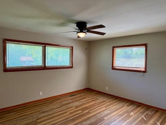 1302 Old Estill Springs Rd, Tullahoma, TN 37388 - unfurnished room with a ceiling fan, wood finished floors, and baseboards