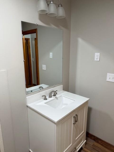 1302 Old Estill Springs Rd, Tullahoma, TN 37388 - bathroom with vanity, wood finished floors, and baseboards