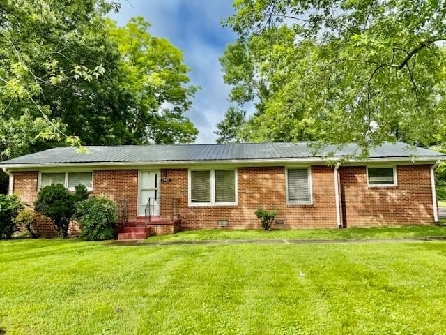 1302 Old Estill Springs Rd, Tullahoma, TN 37388 - ranch-style house featuring a front yard and brick siding