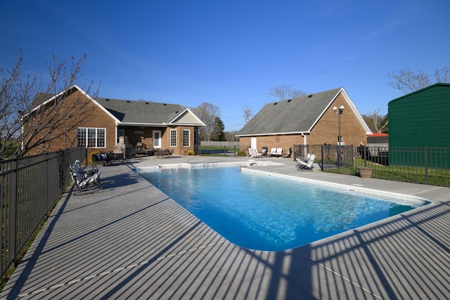 view of pool featuring a patio, a fenced in pool, and a fenced backyard