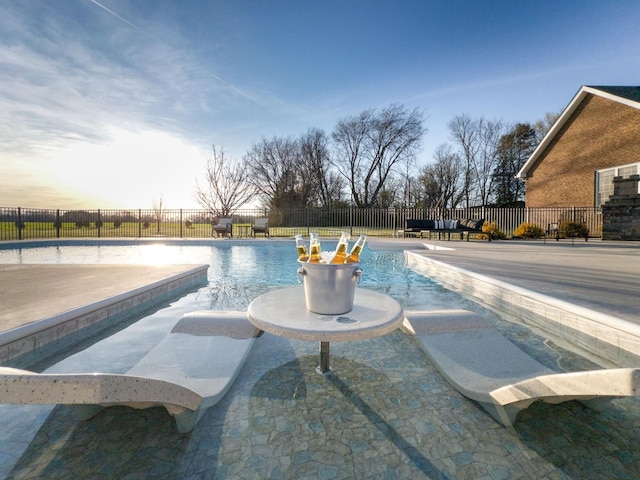 view of pool featuring a patio, a fenced in pool, and a fenced backyard