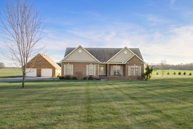 view of front of house with brick siding, a front yard, and a garage