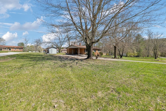 112 Payne Ave, Tracy City, TN 37387 - view of yard with an attached carport and an outdoor structure