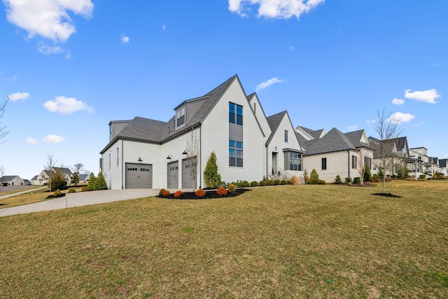 view of home's exterior featuring a residential view, driveway, a garage, and a lawn